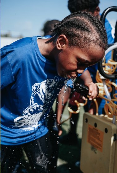 Sports - youth athlete drinking water